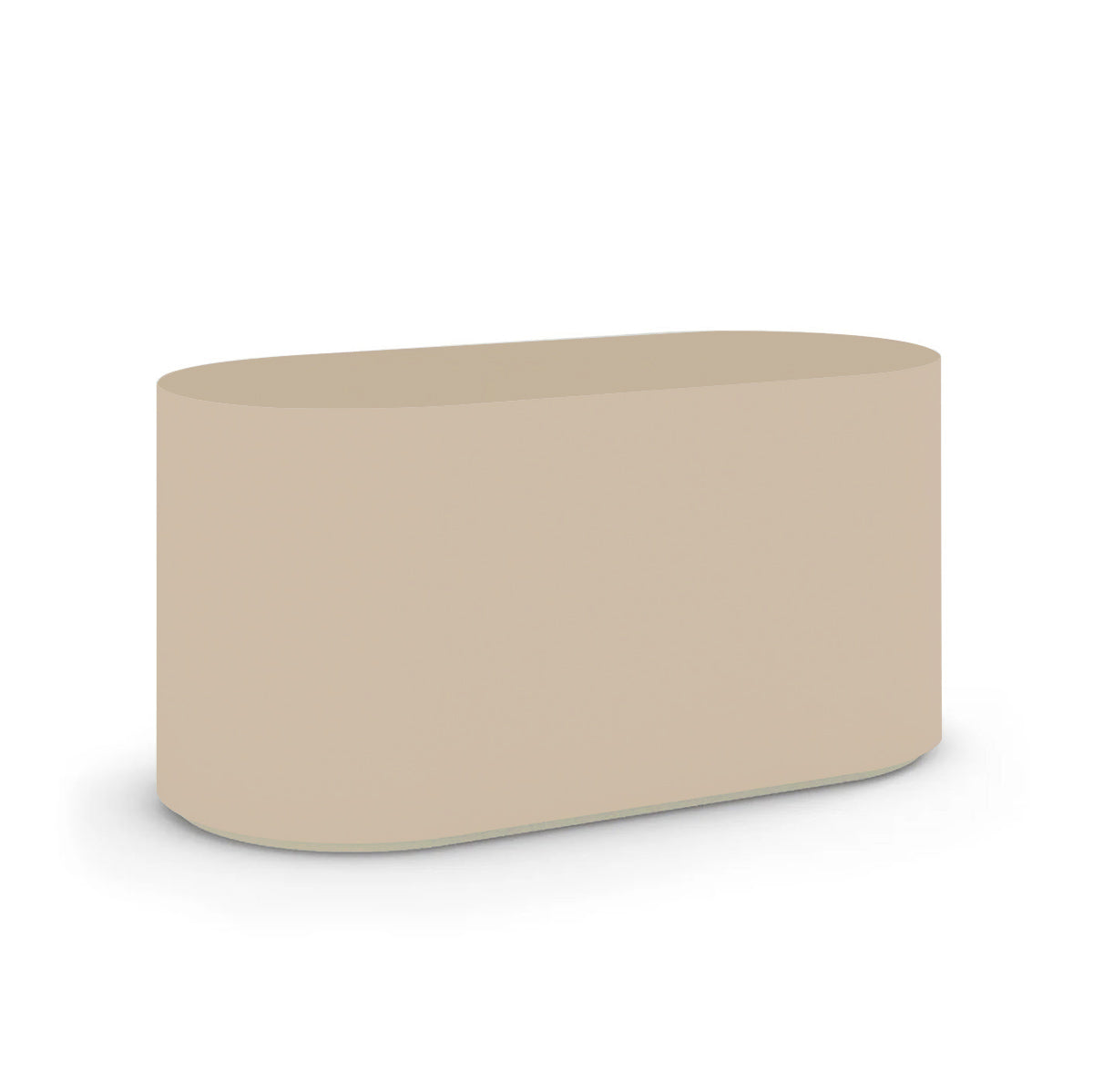 Angled view of the Capitola Oval Concrete Table, cast in lightweight GFRC with smooth curves and refined detailing, shown here in the Desert Dawn finish.