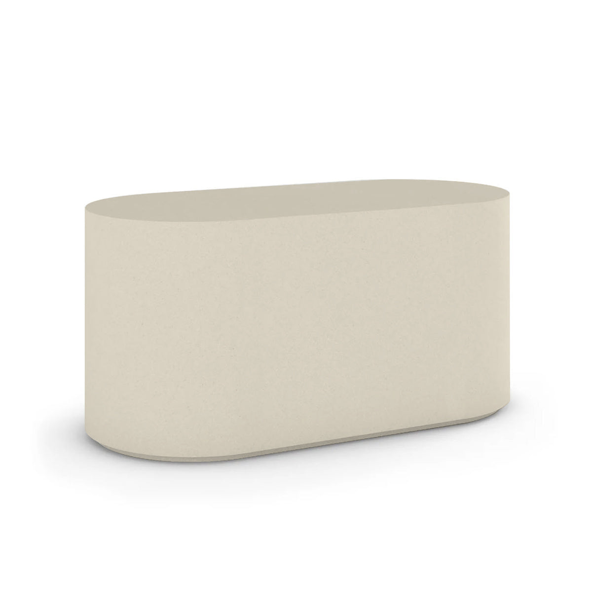 Angled view of the Capitola Oval Concrete Table, cast in lightweight GFRC with smooth curves and refined detailing, shown here in the Limestone Veil finish.