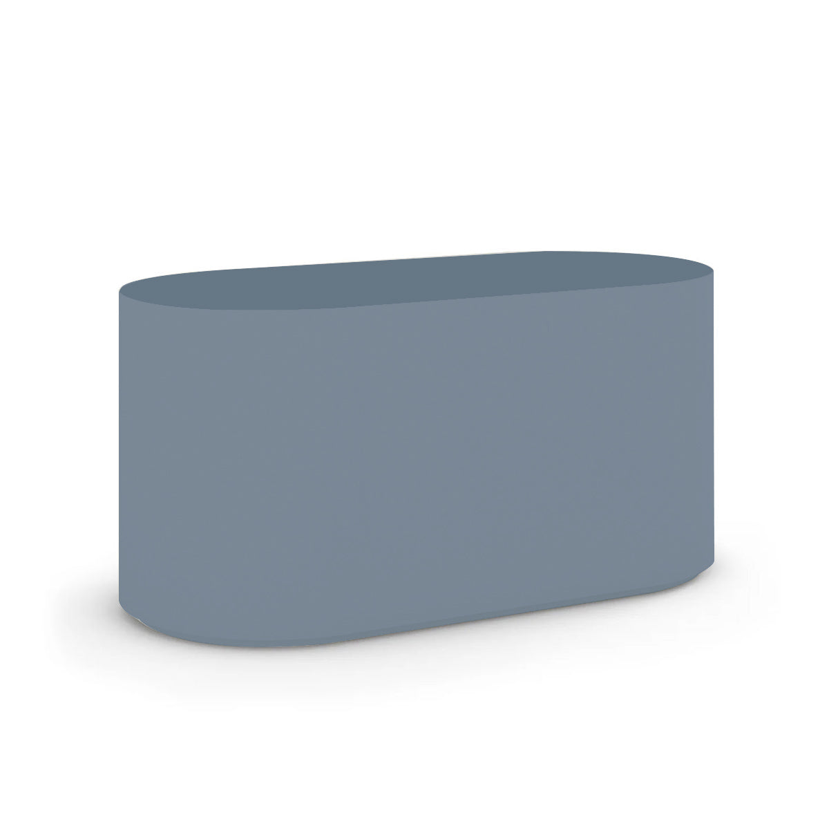 Angled view of the Capitola Oval Concrete Table, cast in lightweight GFRC with smooth curves and refined detailing, shown here in the Seafoam Slate finish.