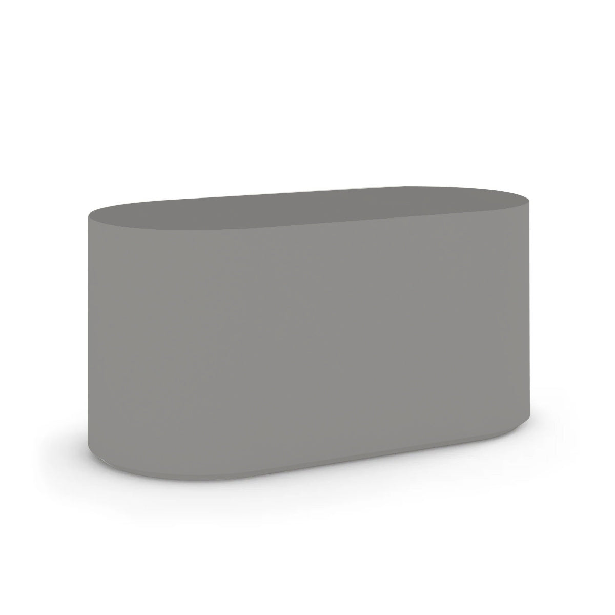 Angled view of the Capitola Oval Concrete Table, cast in lightweight GFRC with smooth curves and refined detailing, shown here in the Silver Mist finish.