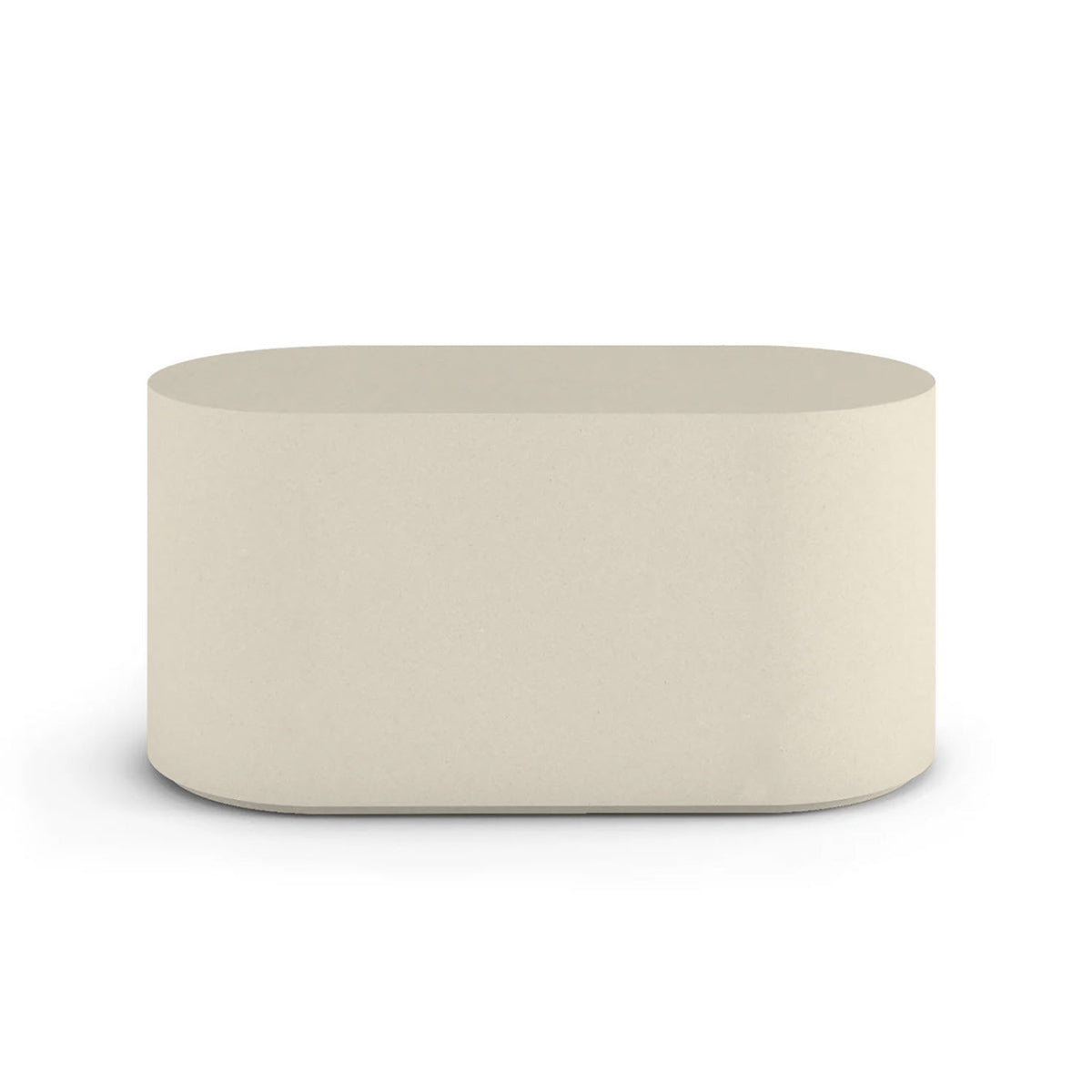 Side profile of the Capitola Oval Concrete Table, highlighting the seamless GFRC construction and soft oval shape, shown in the Limestone Veil finish.