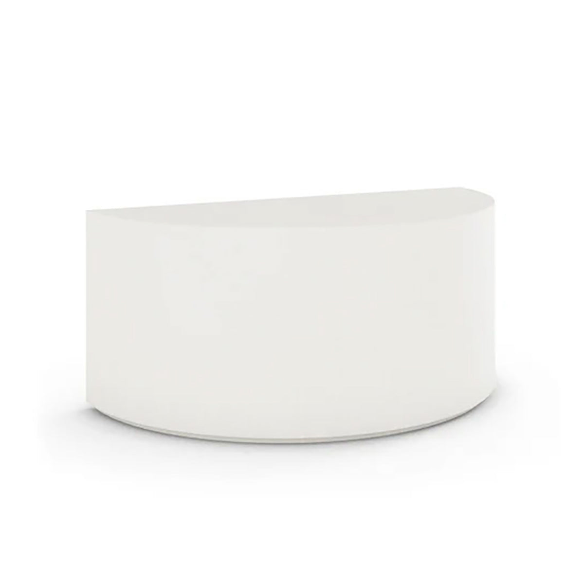 An angled view of the Half Moon Concrete Table highlights the seamless GFRC construction and soft semicircular shape shown in the Glacial Mist finish.