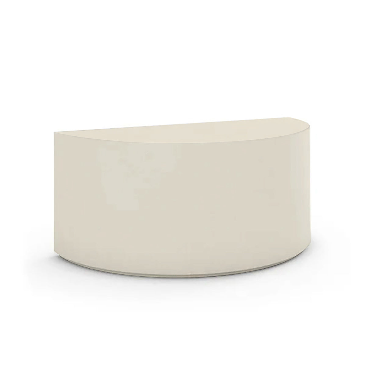 An angled view of the Half Moon Concrete Table highlights the seamless GFRC construction and soft semicircular shape shown in the Limestone Veil finish.
