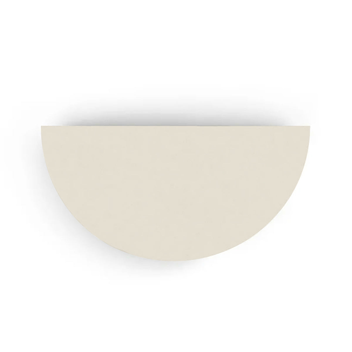 An overhead view of the Half Moon Concrete Table highlights the seamless GFRC construction and soft semicircular shape shown in the Limestone Veil finish.