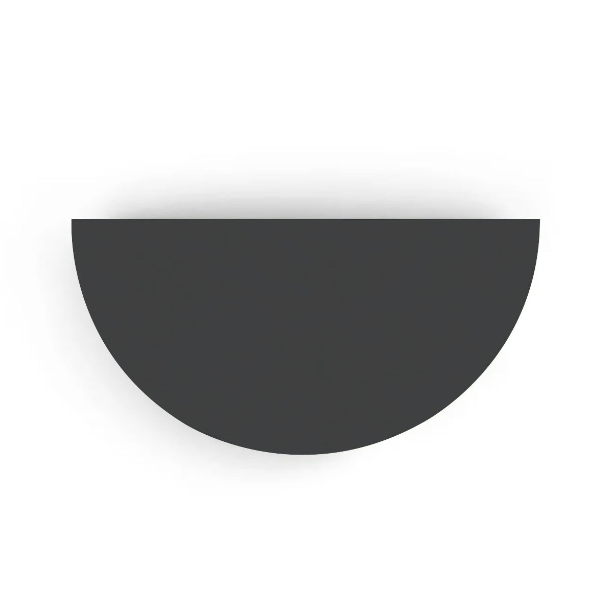 An overhead view of the Half Moon Concrete Table highlights the seamless GFRC construction and soft semicircular shape shown in the Obsidian Night finish.