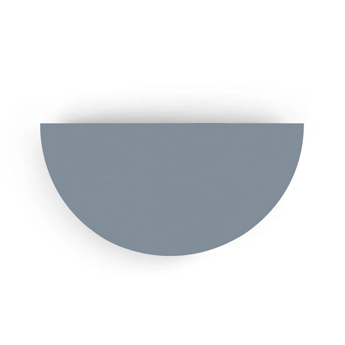 An overhead view of the Half Moon Concrete Table highlights the seamless GFRC construction and soft semicircular shape shown in the Seafoam Slate finish.