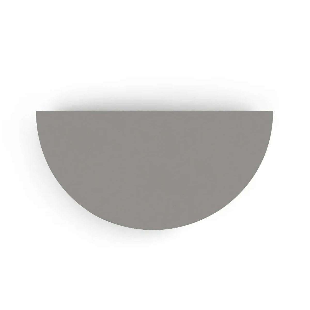 An overhead view of the Half Moon Concrete Table highlights the seamless GFRC construction and soft semicircular shape shown in the Silver Mist finish.