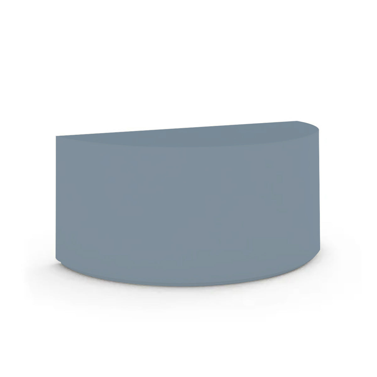 An angled view of the Half Moon Concrete Table highlights the seamless GFRC construction and soft semicircular shape shown in the Seafoam Slate finish.
