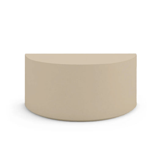 Side profile of the Half Moon Concrete Table, highlighting the seamless GFRC construction and soft Semicircular shape, shown in the Desert Dawn finish.