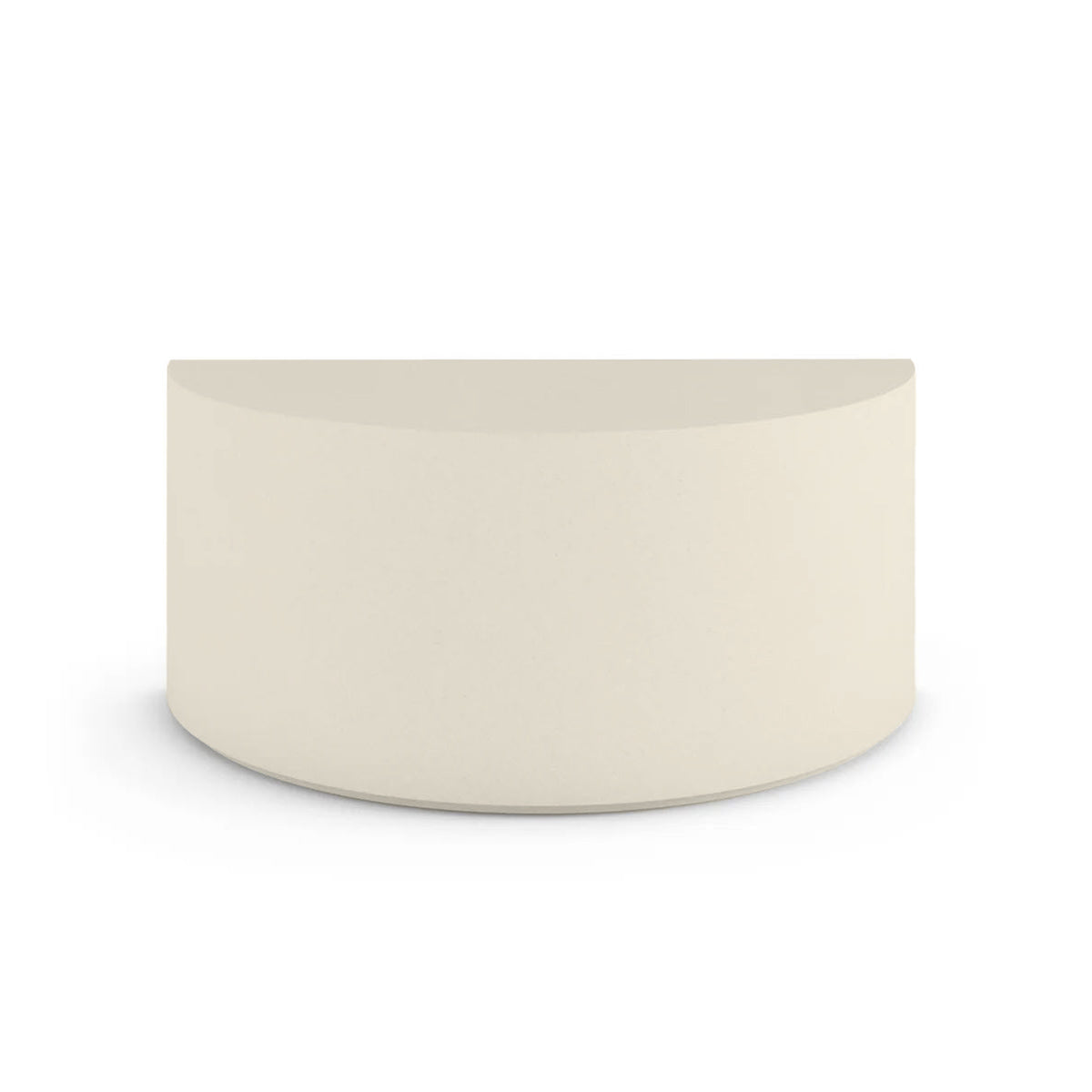 Side profile of the Half Moon Concrete Table, highlighting the seamless GFRC construction and soft Semicircular shape, shown in the Limestone Veil finish.