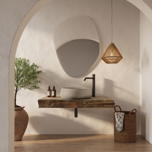 Lifestyle view of the Renner Concrete Sink, highlighting the sculpted circular form and precision-formed drain opening in Desert Dawn finish.