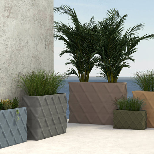 A group of Avila Rectangular Planters in  3D-printed concrete with ribbed texture and diamond pattern, modern lightweight GFRC design for indoor or outdoor use in a lifestyle setting